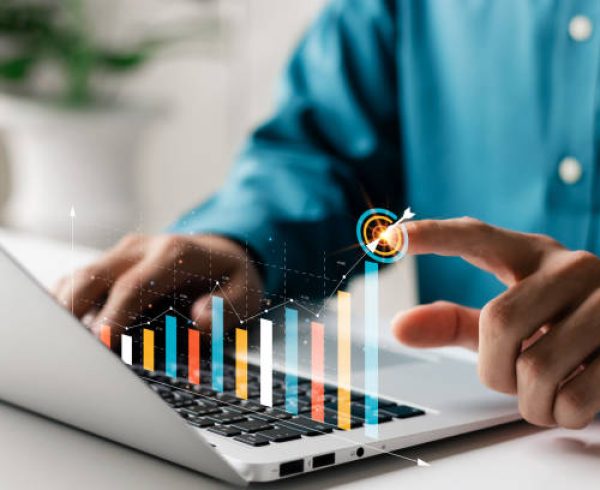 Businessman analyzing company's financial balance sheet working with digital augmented reality graphics. Businessman calculates financial data for long-term investment.